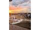 Community picnic and recreation area at sunset with walking paths, picnic shelter and new home development at 295 Kitselman Dr, Castle Rock, CO 80104