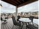 Inviting covered deck featuring outdoor furniture and views of the neighborhood homes at 295 Kitselman Dr, Castle Rock, CO 80104