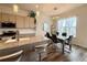 Dining area featuring a modern table set, views, stylish light fixtures, and kitchen access at 295 Kitselman Dr, Castle Rock, CO 80104