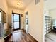 Inviting entryway features an open door, hardwood floors, and views to the outside at 295 Kitselman Dr, Castle Rock, CO 80104