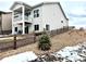 Back exterior of a house with a second-story deck, stone landscaping, and a wooden fence at 295 Kitselman Dr, Castle Rock, CO 80104