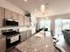 Modern kitchen with stainless steel appliances, granite countertops, and a breakfast bar at 295 Kitselman Dr, Castle Rock, CO 80104