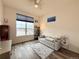 A well-lit living room featuring a sofa and a large window with neighborhood views at 295 Kitselman Dr, Castle Rock, CO 80104