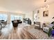 Open-concept living area with hardwood floors, a cozy seating area, and a dining space at 295 Kitselman Dr, Castle Rock, CO 80104