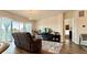 Comfortable living room featuring a fireplace, entertainment center, and sliding glass doors at 295 Kitselman Dr, Castle Rock, CO 80104