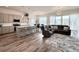 Open-concept living room featuring modern kitchen, dining area, and a cozy seating area at 295 Kitselman Dr, Castle Rock, CO 80104