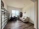 Bright living room with dark hardwood floors, built-in shelves, and lots of natural light at 295 Kitselman Dr, Castle Rock, CO 80104