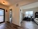 Bright office featuring hardwood floors, neutral color palette, and an open doorway to the entryway at 295 Kitselman Dr, Castle Rock, CO 80104