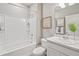 Clean bathroom with white vanity and a bathtub shower combo at 4410 Cattle Cross Rd, Castle Rock, CO 80104