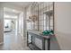 Bright entryway with console table and large mirrors at 4410 Cattle Cross Rd, Castle Rock, CO 80104