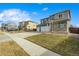 Two-story house with stone and siding exterior, large driveway at 4410 Cattle Cross Rd, Castle Rock, CO 80104