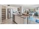 Modern kitchen with white cabinets, stainless steel appliances, and an island at 4410 Cattle Cross Rd, Castle Rock, CO 80104