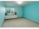 Bright bedroom featuring a window seat with built-in storage and ample natural light at 14910 Williams St, Thornton, CO 80602