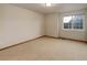 Standard bedroom with neutral carpet and bright natural light at 14910 Williams St, Thornton, CO 80602