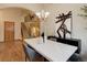 Bright dining area adjacent to the staircase featuring hardwood floors and stylish furnishings at 14910 Williams St, Thornton, CO 80602