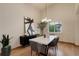 Contemporary dining room showcasing a modern table, sleek decor, and an abundance of natural light at 14910 Williams St, Thornton, CO 80602