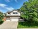 Charming home with a three-car garage, well-maintained lawn, and mature landscaping at 14910 Williams St, Thornton, CO 80602