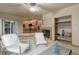 Cozy living room featuring a fireplace and a view of the kitchen and dining area at 14910 Williams St, Thornton, CO 80602