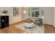 Cozy sitting area bathed in natural light, featuring comfortable seating and stylish decor at 14910 Williams St, Thornton, CO 80602