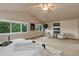 Spacious main bedroom with a sitting area, ceiling fan and a light-filled atmosphere at 14910 Williams St, Thornton, CO 80602