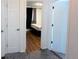 Bedroom featuring a hardwood floor and entrance to the bathroom and closet at 413 Jamaica St, Aurora, CO 80010