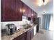 Kitchen featuring stainless steel appliances, ample cabinet space, and light granite countertops at 413 Jamaica St, Aurora, CO 80010