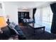 Bright living room featuring two plush sofas, a decorative coffee table, and large windows at 413 Jamaica St, Aurora, CO 80010