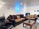 Inviting living room with sofas, coffee table, and ambient lighting at 413 Jamaica St, Aurora, CO 80010