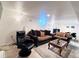 Spacious living room featuring sofas, chair, and a decorative rug at 413 Jamaica St, Aurora, CO 80010