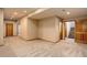 View of the finished basement featuring neutral carpet and access to the stairwell at 9299 William Cody Dr, Evergreen, CO 80439