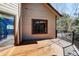 This outdoor deck has wood flooring and black railings, providing a relaxing outdoor space at 9299 William Cody Dr, Evergreen, CO 80439