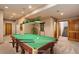 Recreation room complete with a billiards table for entertainment at 9299 William Cody Dr, Evergreen, CO 80439