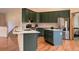 Well-equipped kitchen featuring a center island, stainless steel appliances, and ample cabinetry at 9299 William Cody Dr, Evergreen, CO 80439