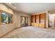 Inviting living room with natural light, and a built-in bookcase for storage and decor at 9299 William Cody Dr, Evergreen, CO 80439