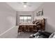 Bright bedroom featuring a decorative headboard and a comfortable reclining chair at 9318 Las Ramblas Ct # R, Parker, CO 80134