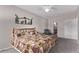 Spacious bedroom with a ceiling fan, and a comfortable bed featuring wood-inspired frame at 9318 Las Ramblas Ct # R, Parker, CO 80134