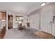 Dining area features elegant lighting, a large mirror, and space for a table and chairs next to the kitchen entrance at 9318 Las Ramblas Ct # R, Parker, CO 80134