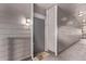 Hallway view with neutral gray tones and multiple overhead lights leading to unit entrance at 9318 Las Ramblas Ct # R, Parker, CO 80134