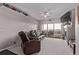 Comfortable living room with plush leather seating, a fireplace, and a sliding door to the balcony at 9318 Las Ramblas Ct # R, Parker, CO 80134