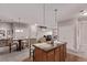 Open living room and dining area with a spacious island, great for entertaining guests at 9318 Las Ramblas Ct # R, Parker, CO 80134