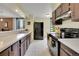 Well-equipped kitchen boasting ample counter space and dark wood cabinetry at 1625 Larimer St # 807, Denver, CO 80202