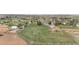 Aerial view of a horse property featuring a home, barn, riding arena, and fenced pastures at 15020 Harrison St, Brighton, CO 80602