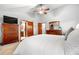 Bright and open bedroom layout with ensuite bathroom featuring wood dresser and coordinated decor at 15020 Harrison St, Brighton, CO 80602