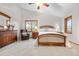 Spacious bedroom features a large bed, hardwood furniture, and lots of natural light from multiple windows at 15020 Harrison St, Brighton, CO 80602