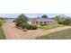 Exterior elevation of a single Gathering home, featuring a covered porch and landscaped front yard at 15020 Harrison St, Brighton, CO 80602