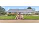 A well-maintained single Gathering home featuring a covered porch and landscaped front yard at 15020 Harrison St, Brighton, CO 80602