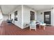 Inviting front porch with comfortable seating, stylish decor, and ample space for relaxing at 15020 Harrison St, Brighton, CO 80602