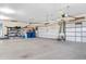 Two-car garage features ample storage, high ceilings, garage door openers, and epoxy-coated floors at 15020 Harrison St, Brighton, CO 80602
