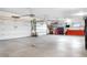 Spacious two-car garage with automatic door openers, cabinets, work bench, and ample storage at 15020 Harrison St, Brighton, CO 80602