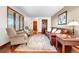 Cozy living room with hardwood floors, a comfortable sofa, and bright, natural light at 15020 Harrison St, Brighton, CO 80602